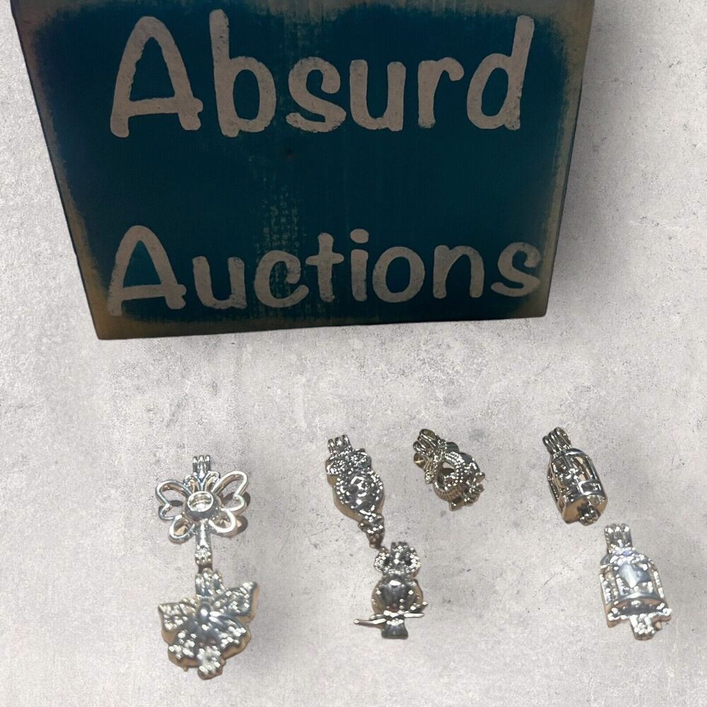Silver Animal Shaped Pearl Cage Pendants and 20 or 24 inch necklaces.